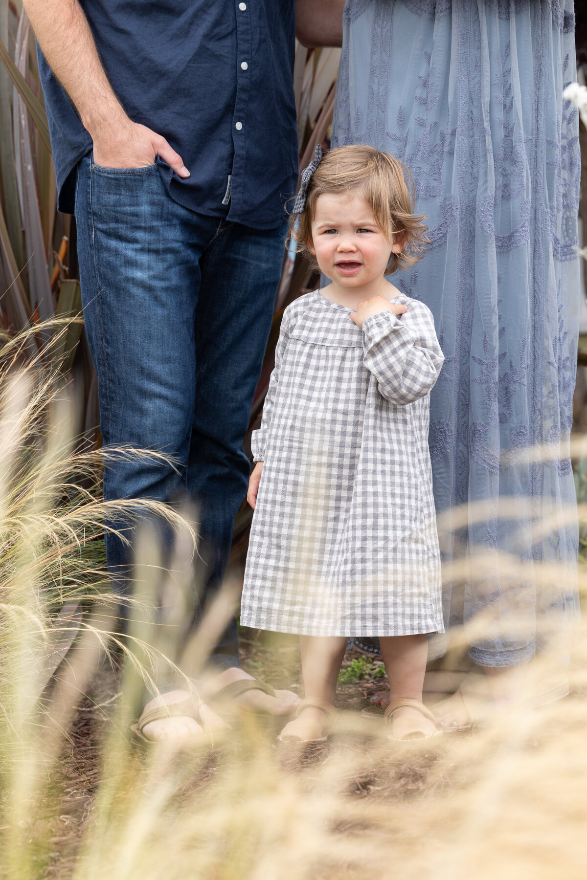 daughter standing near her parents