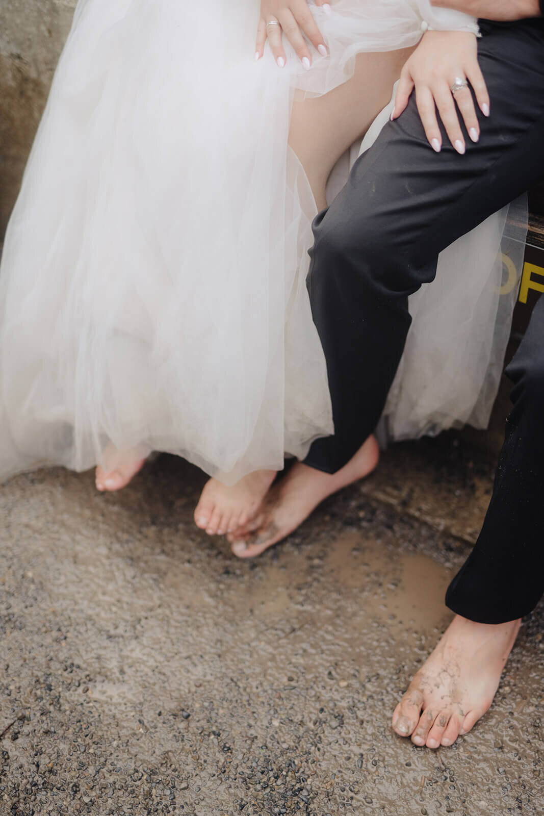 bride and groom sat down with bare feet