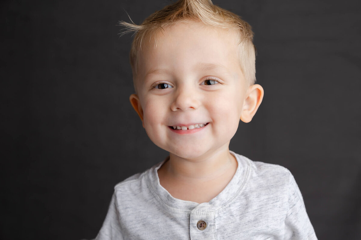 Las vegas Fine Art School Portrait of a blonde boy with a mohawk hair style in a white shirt