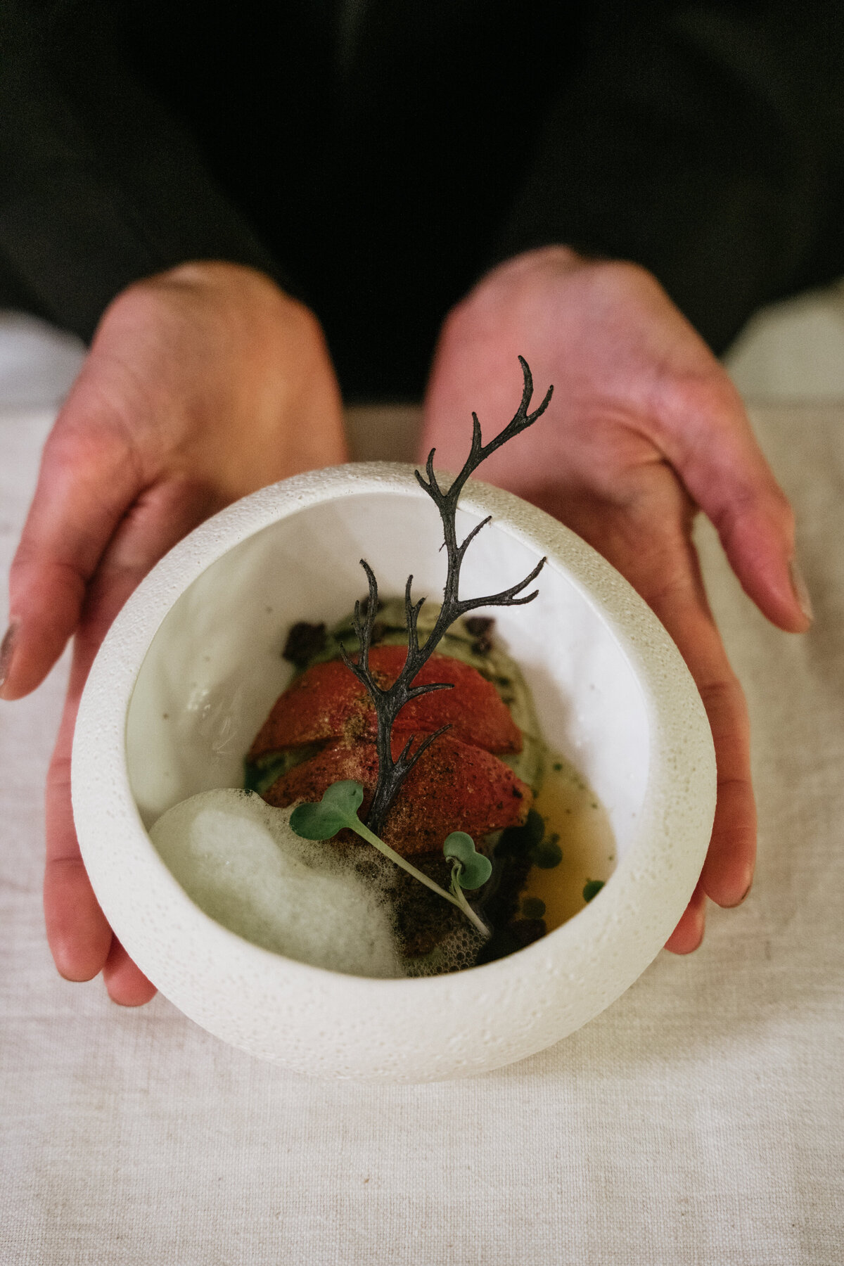 Vegan plated dish with autumn leaf garnish