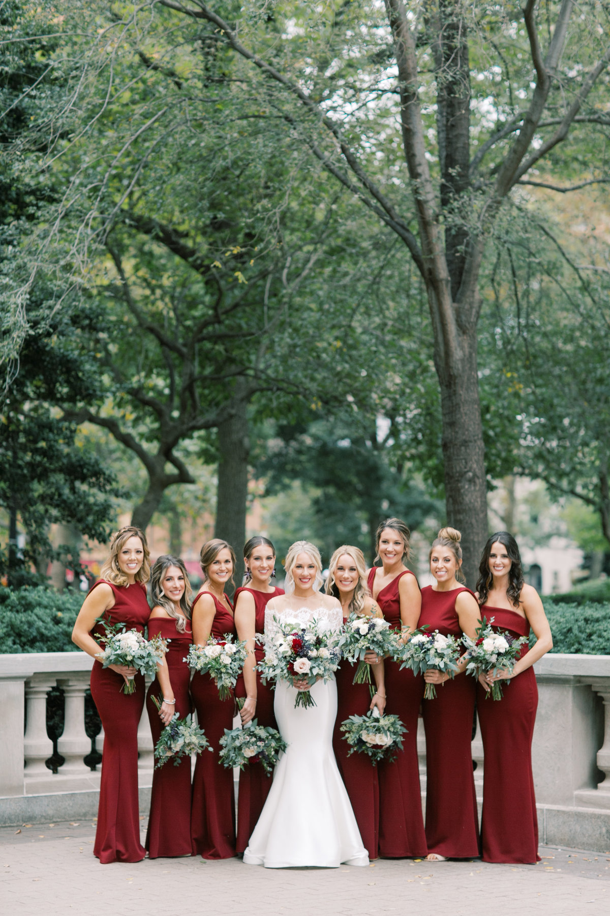 bride and bridesmaids together during portraits during spring wedding