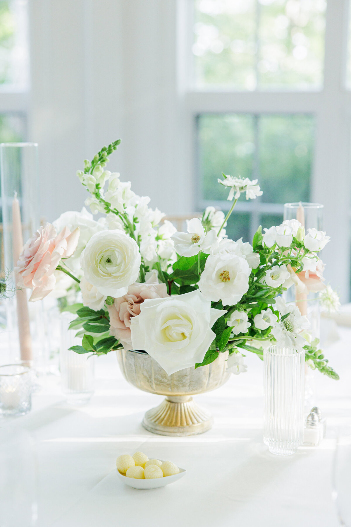 Close up of blush and white floral centerpiece for Tupper Manor wedding reception
