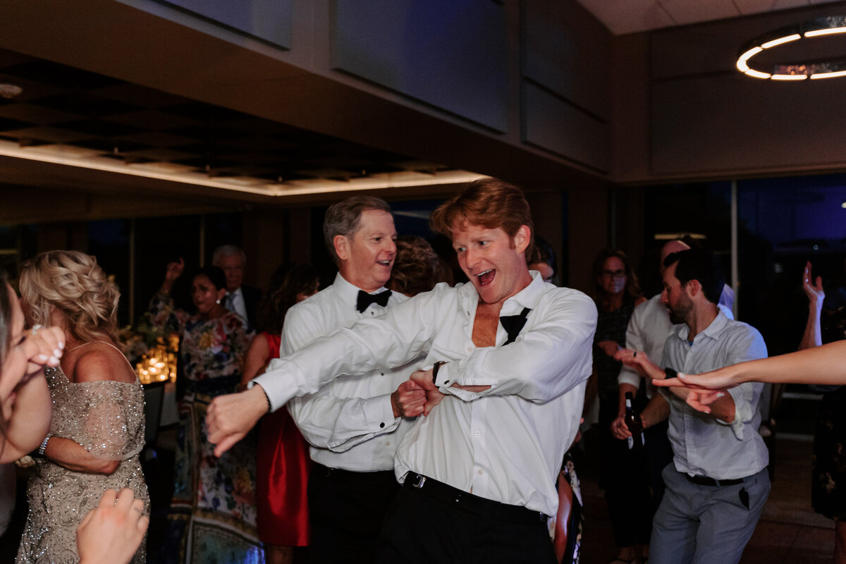 Wedding guests dancing at a reception
