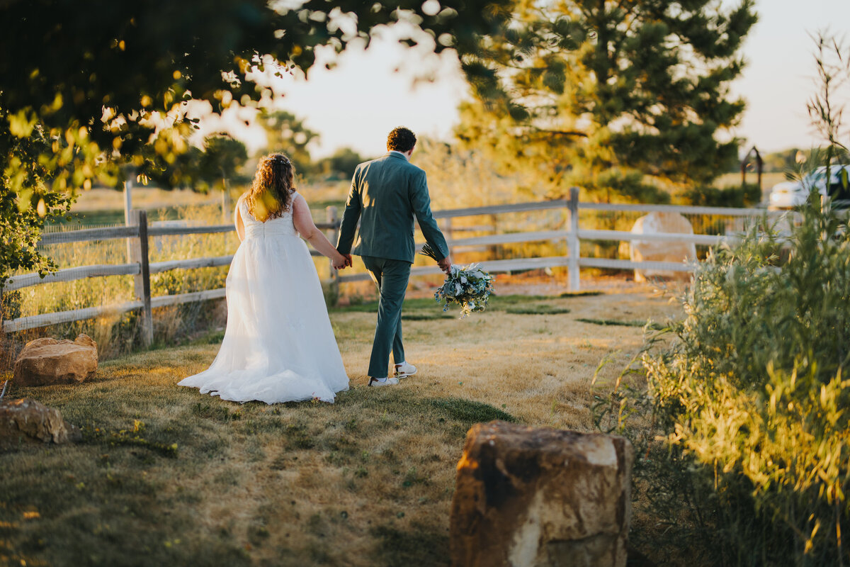 Couple walking a path along the fence