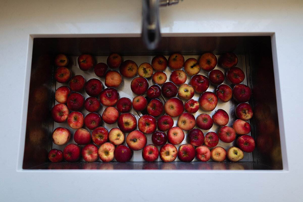 sink full of red apples