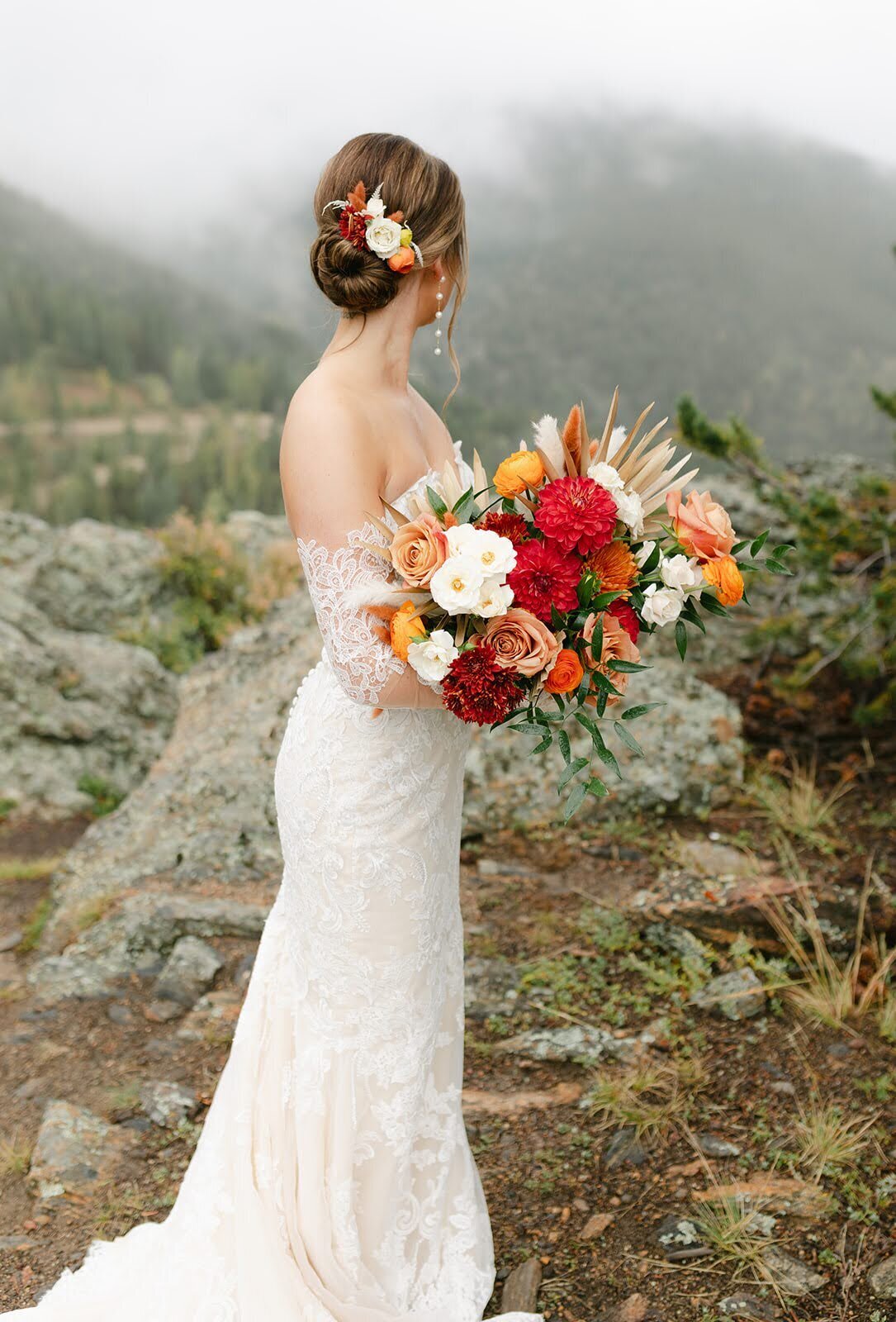 Fully ready bride with her fall colored bouquet at North Star Gatherings.