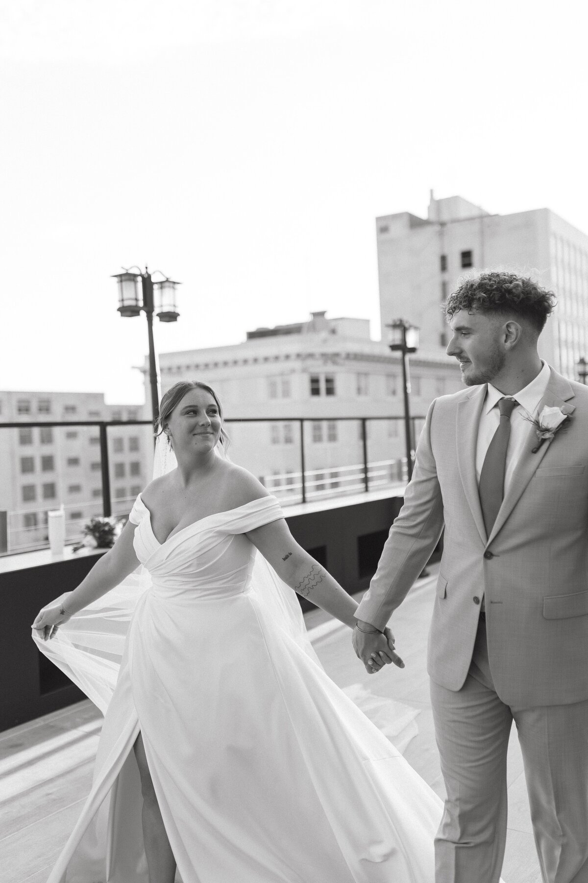 bride and groom walking hand in hand