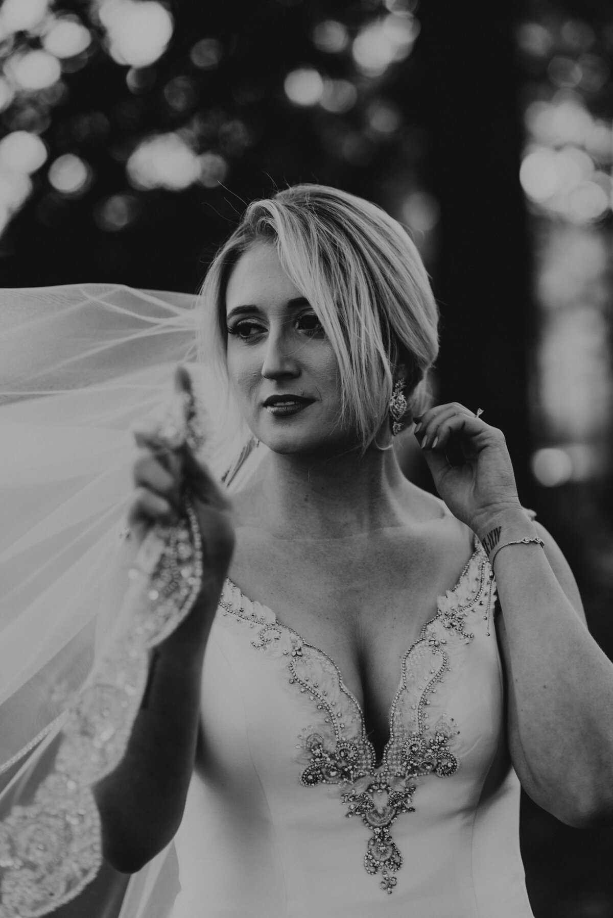 A bride holds her veil