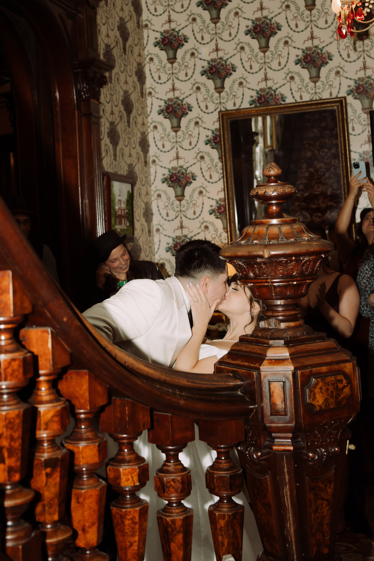 newly married couple kissing in old beautiful house
