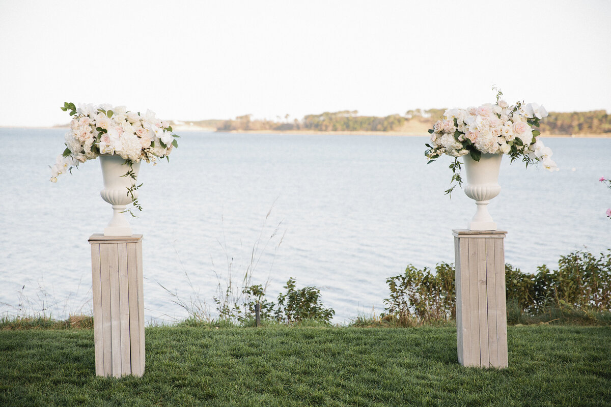 Ceremony floral urns on pedestals for coastal wedding at Wequassett Resort
