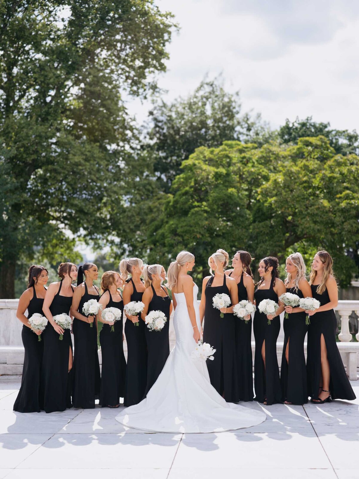 Bride with bridesmaids in black and white at Cleveland Art Museum