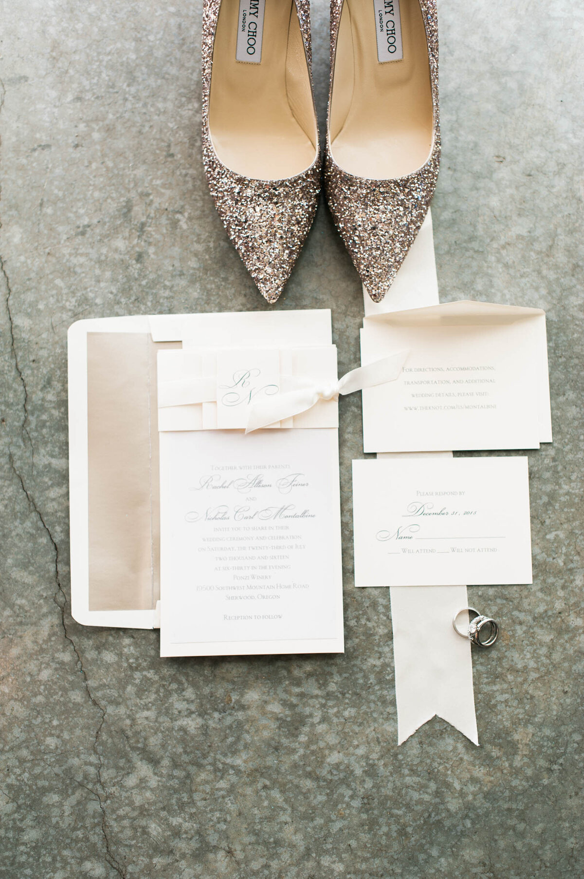 wedding invitation suite at ponzi winery displayed with brides shoes
