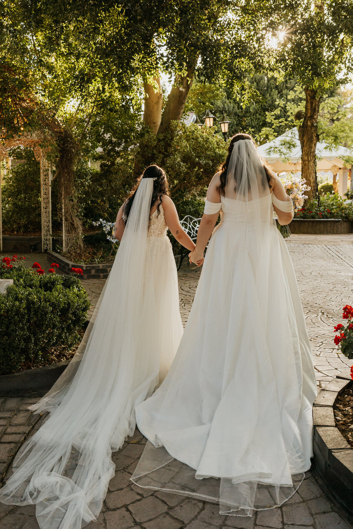 A newlywed couple holding hands and walking away 