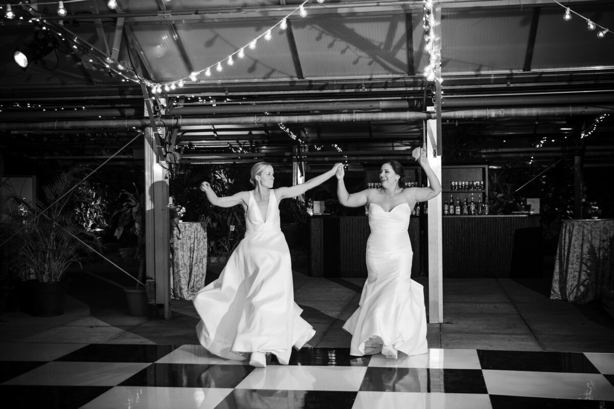 A couple enters their reception at a  Fairmount Park Horticulture Center wedding