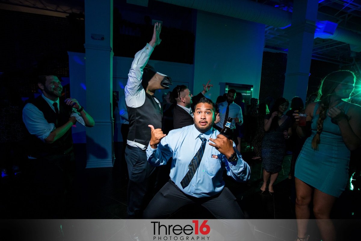 Male guest dancing at the wedding reception