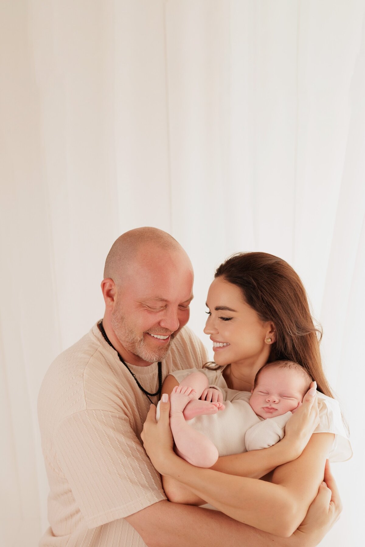 Beautiful newborn portraits in Elk Grove and Sacramento, capturing your baby's precious moments with simple elegance. Book your session today,celebrating surrogacy newborn photoshoot