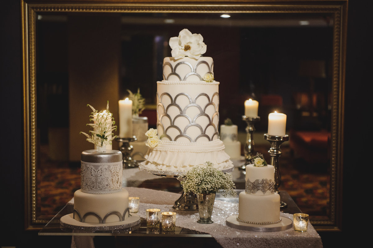 3 white tiered wedding cakes