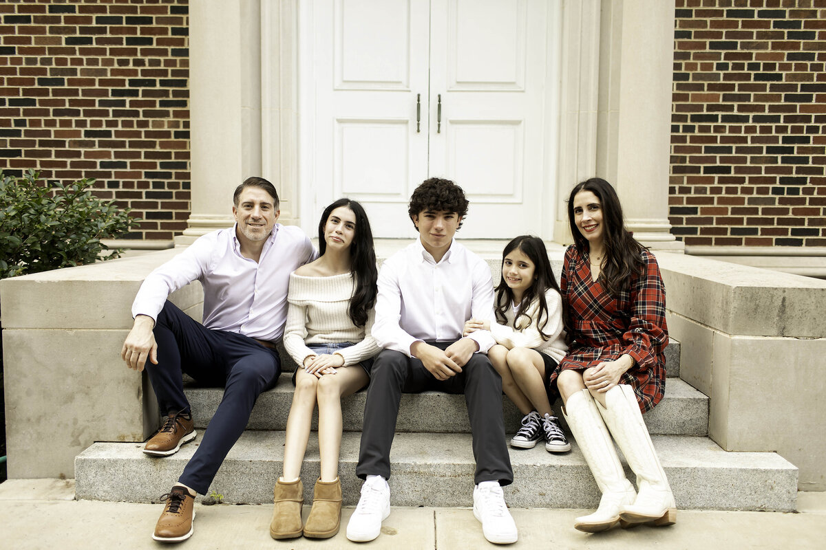 Family fun and laughter captured on camera, as they enjoy their time together in a vibrant photoshoot
