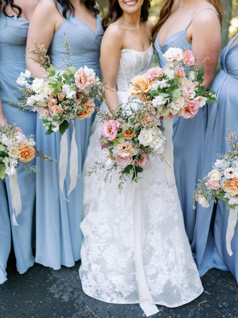Bridal party holding bouquets by wedding planners chicago