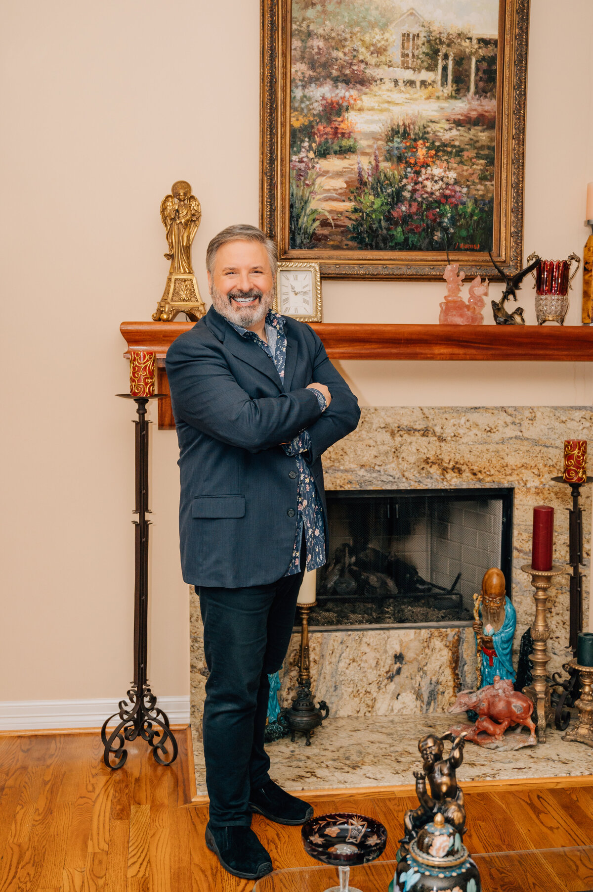 Ernie Manouse posing indoors near fireplace during Houston branding shoot by Lissette G Photography