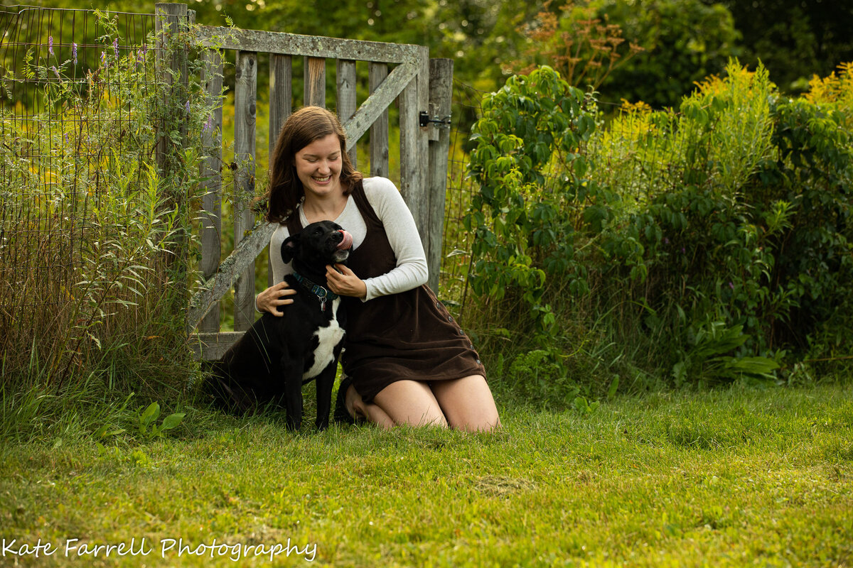 A teen girl and her black dog