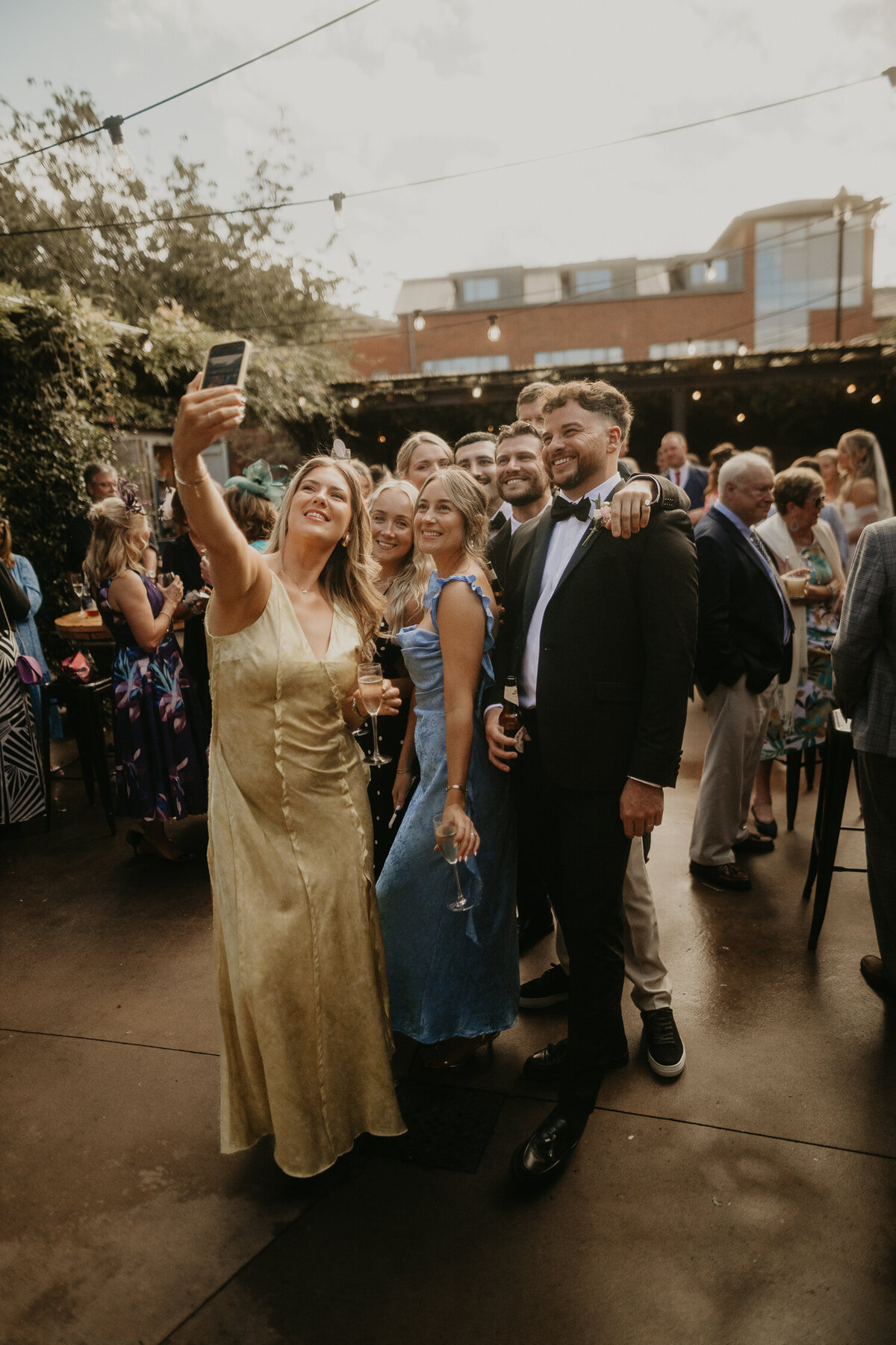 Group take a selfie with groom at at The Shack Revolution. 