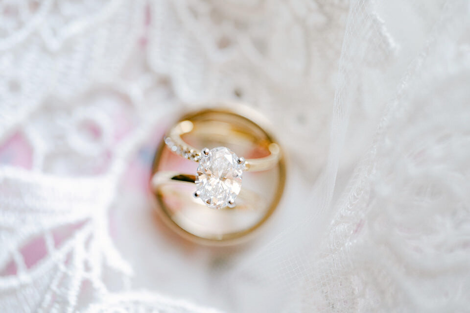 Wedding rings on floral lace