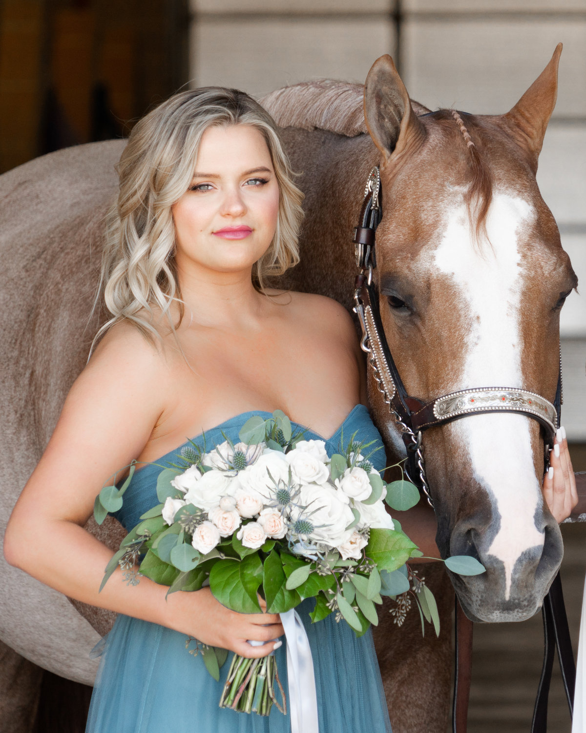 Bridesmaid in teal dress and horse