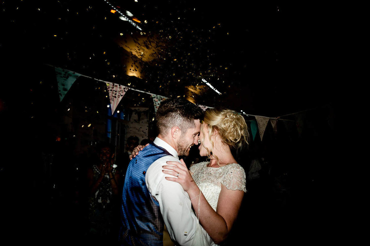 wedding couples doing a first dance during a tipi wedding