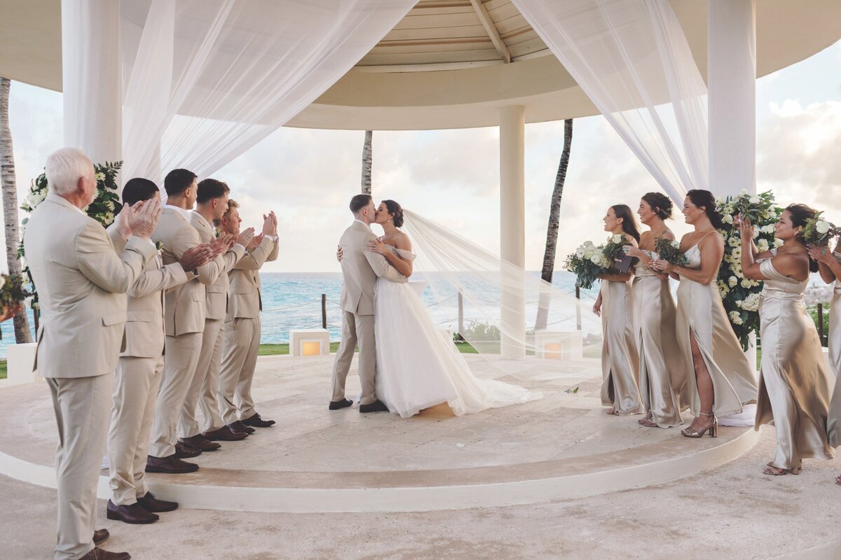 Bride and Grooms first kiss at wedding in Cancun