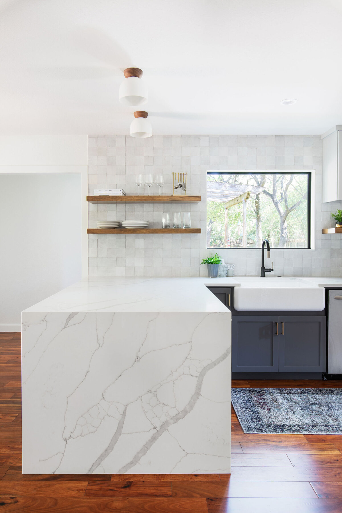 hello-home-two-tone-cabinets-kitchen-remodel-hardwood-flooring-waterfall-peninsula-zellige-backsplash-austin-8
