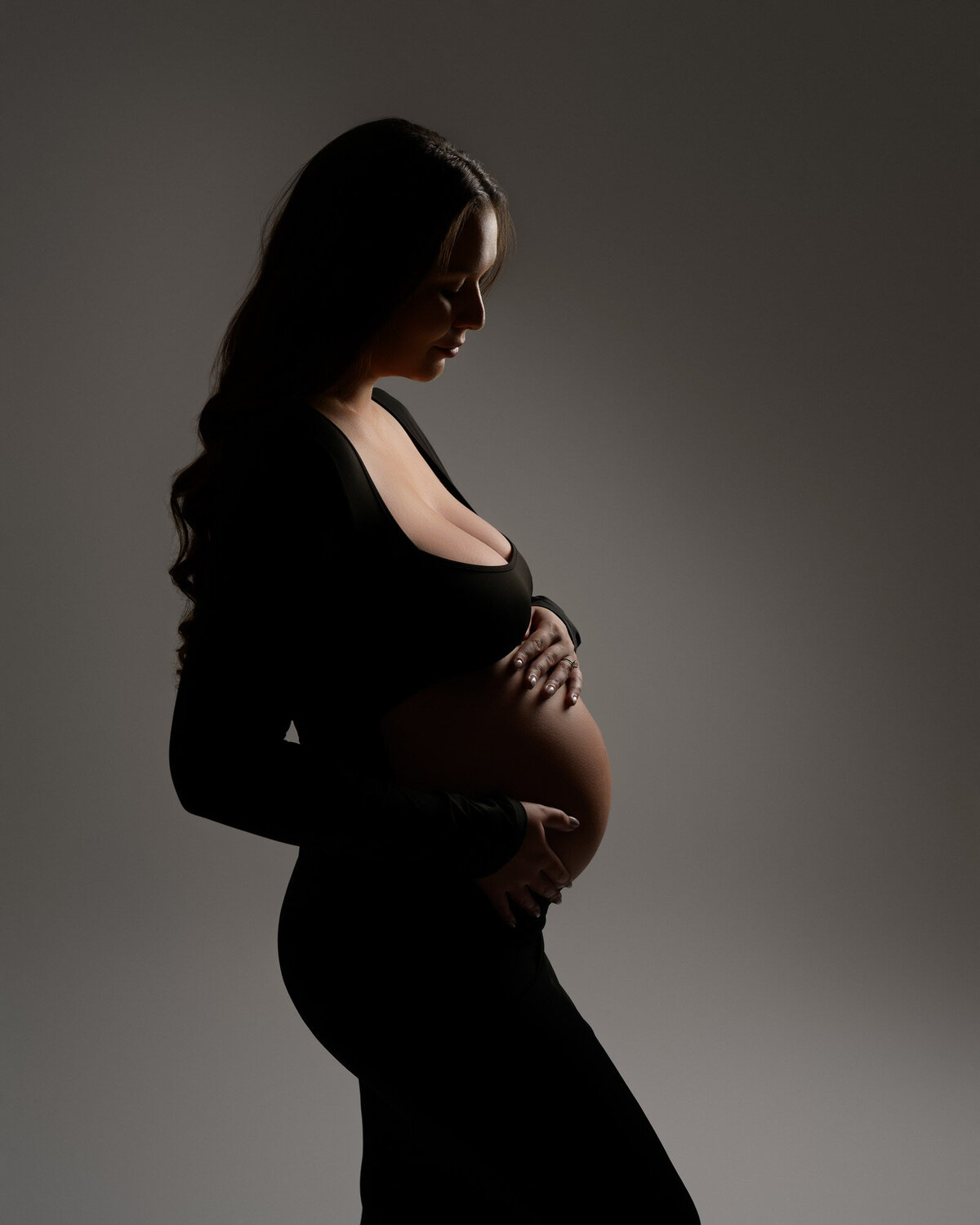 Classic maternity profile by Hutto maternity photographer showcasing beautiful bump silhouette