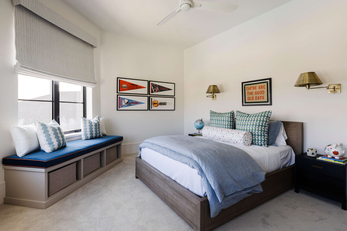 oyster creek studios hughes sports flags with window bench with blue cushion in bedroom