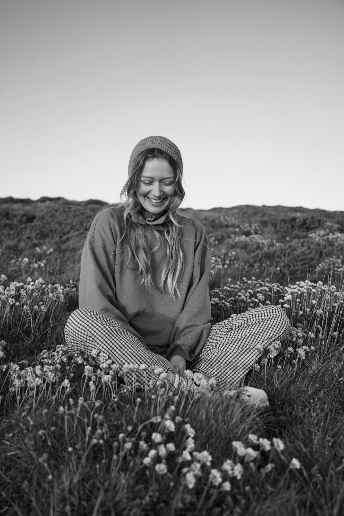 Black and white editorial fashion portrait of a woman in Brittany, France