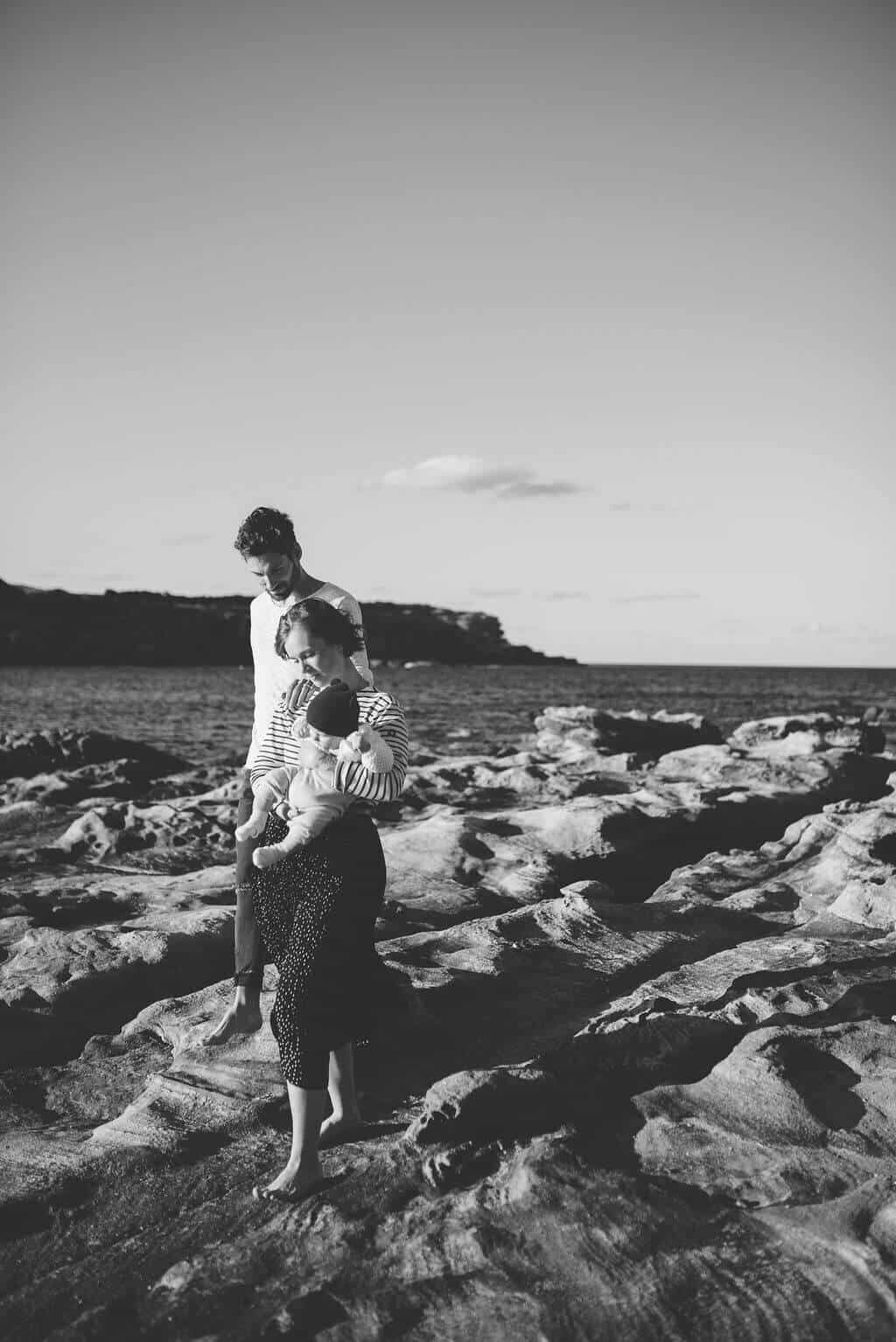 eastern-suburbs-beach-sunset-family-walking-parents-carrying-baby