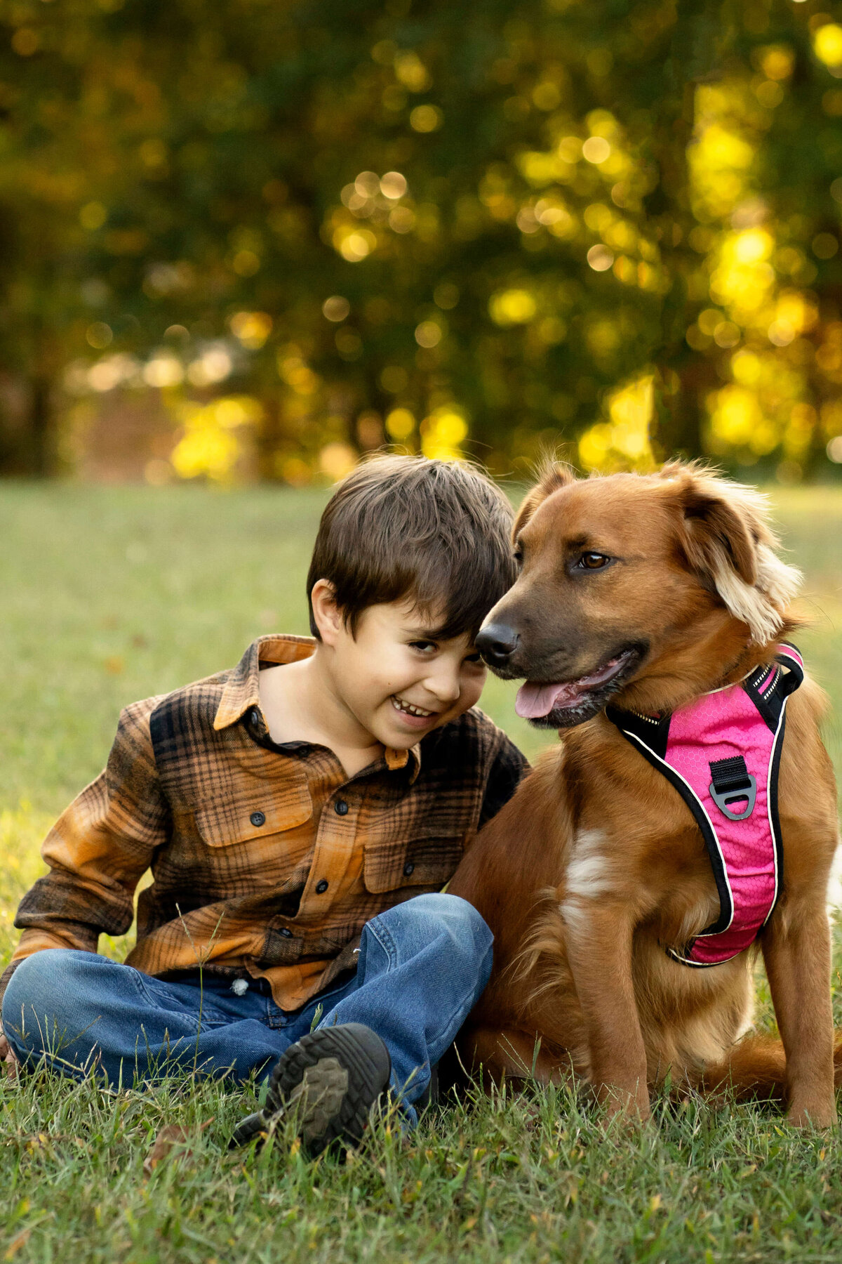 Young boy and his dog during Atlanta family photography session