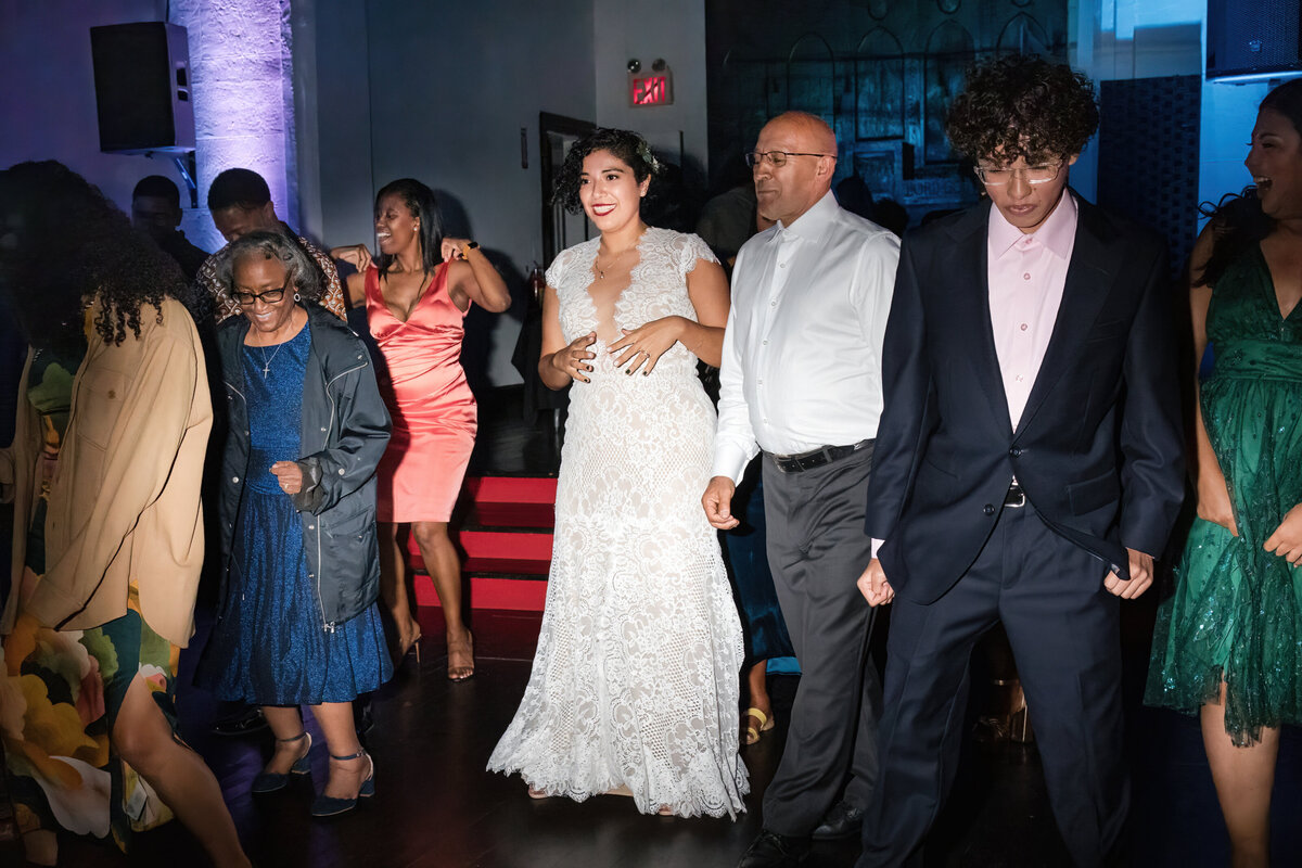 Latino-bride-and-father-trying-the-line-dance