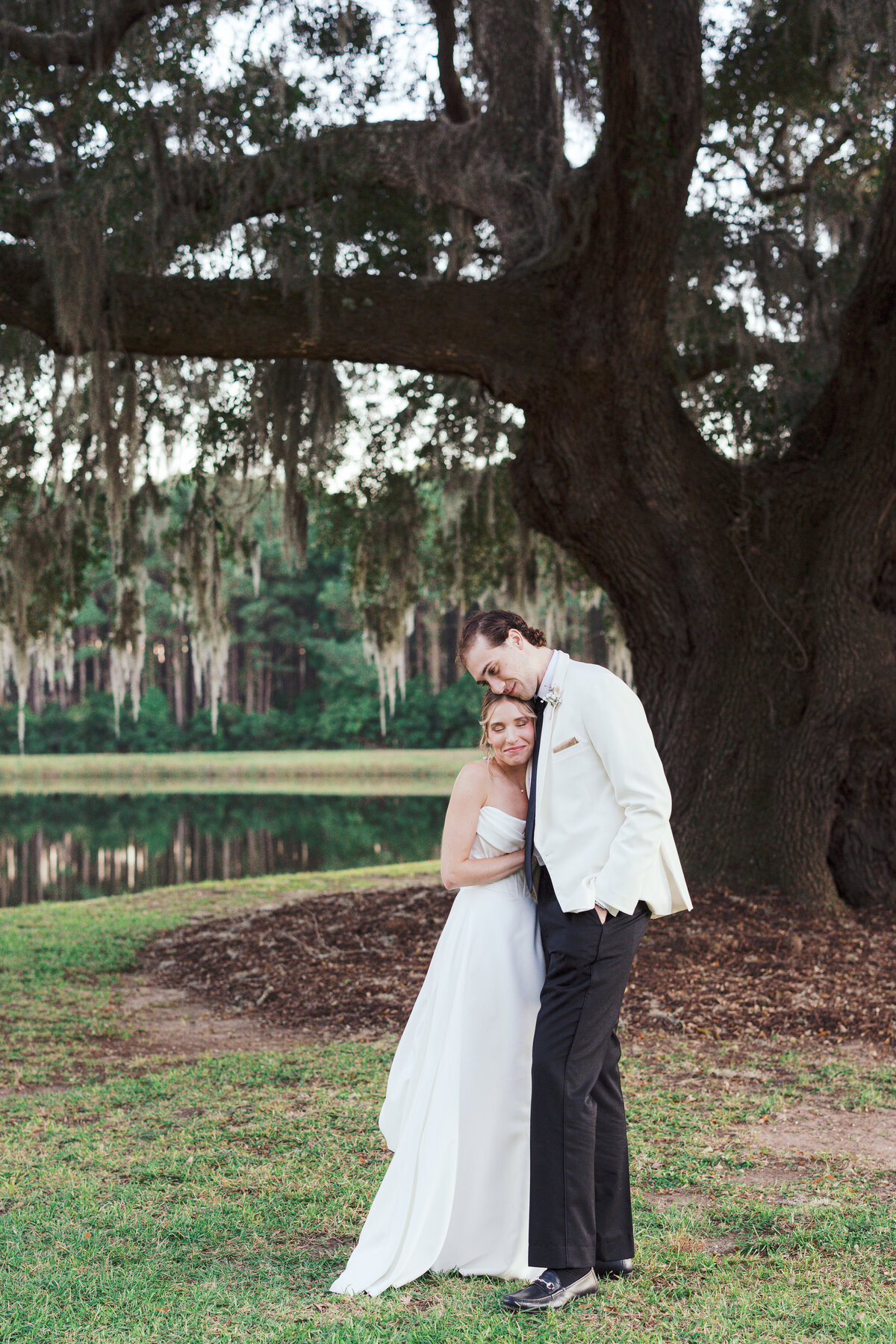 Bride and groom in front of a live oak