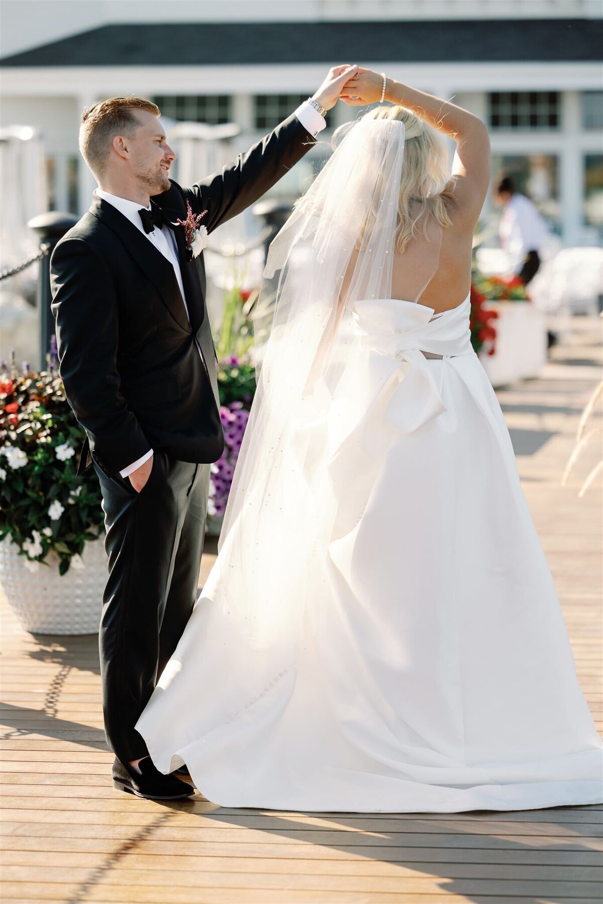 Bride and Groom Dancing on a dock on Mackinac Island