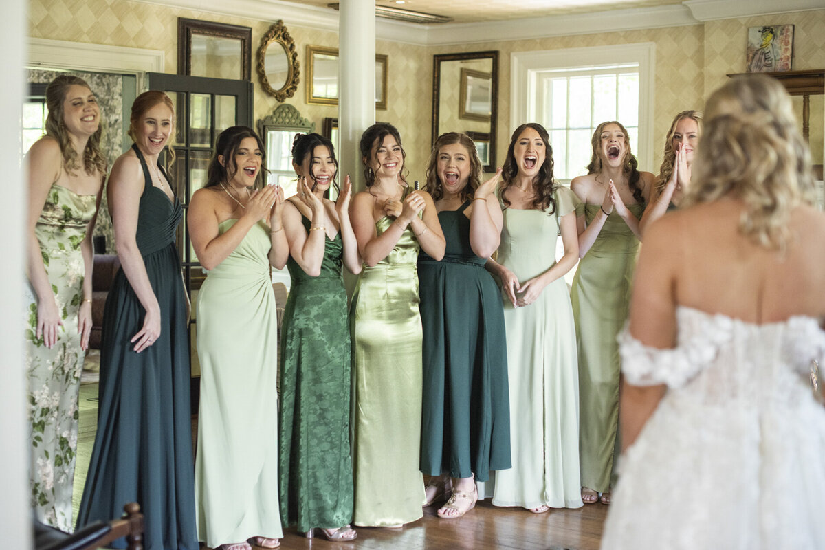 Bride and bridesmaids first look at wedding