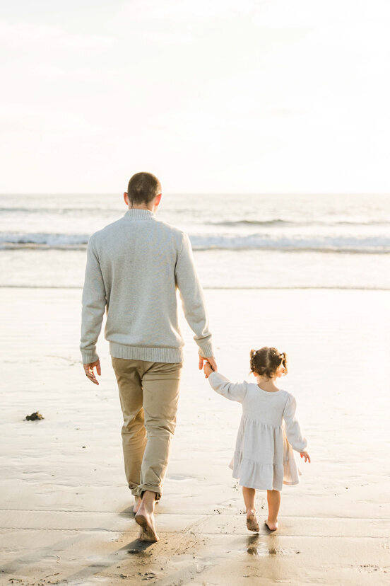 father-and-daugher-holding-hands-Coronado-beach-san-diego