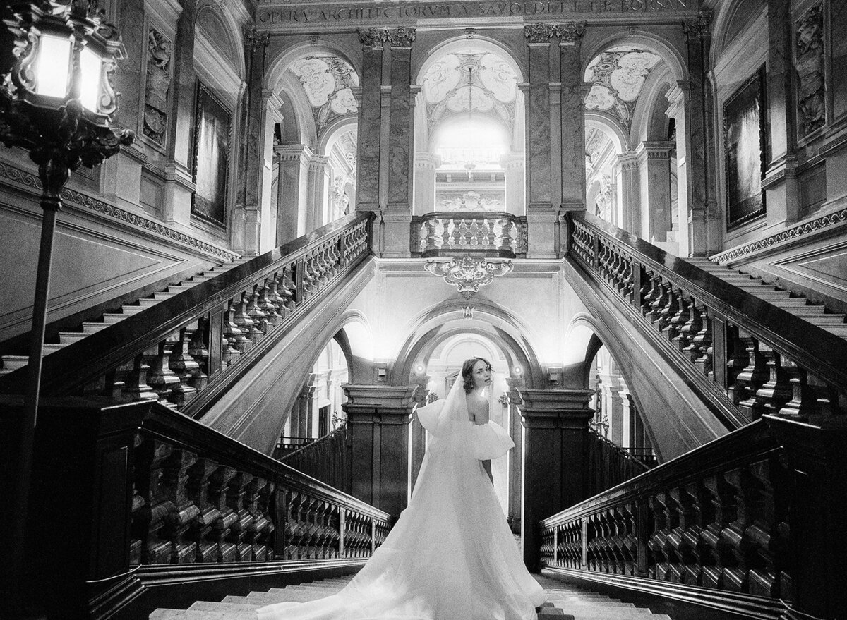 Bride on grand staircase at her Villa Erba Wedding on Lake Como photographed by Italy Wedding photographer
