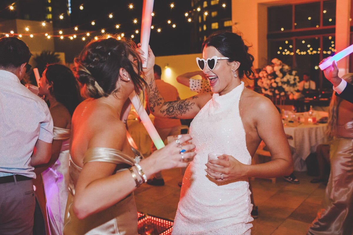 Bride dancing with guests at wedding in Cancun