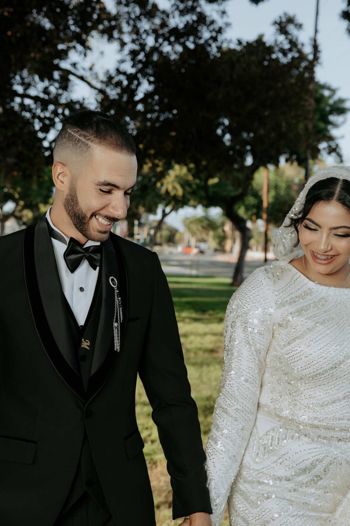 Close-Up Wedding Moment – Bride & Groom Holding Hands in LA Park