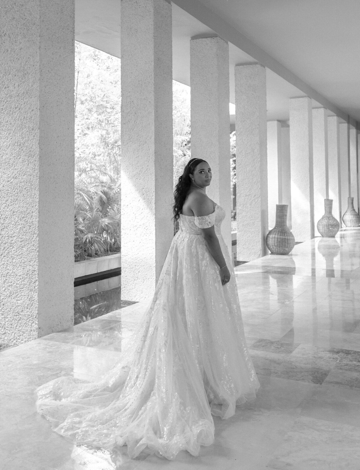 Candid wedding photography in Mexico, bride in long dress at Paradisus resort