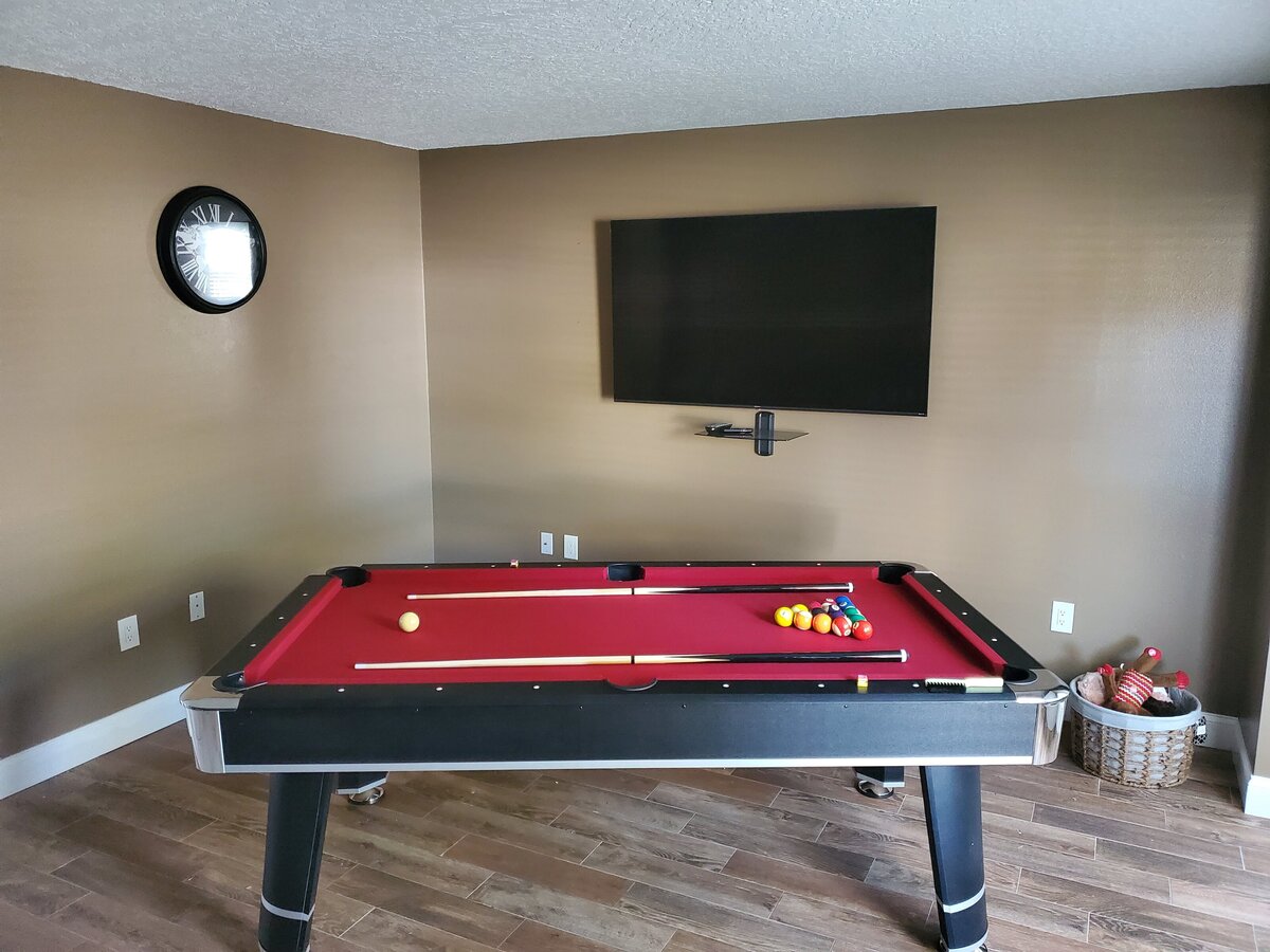 Flat Screen Mounted in front of pool table