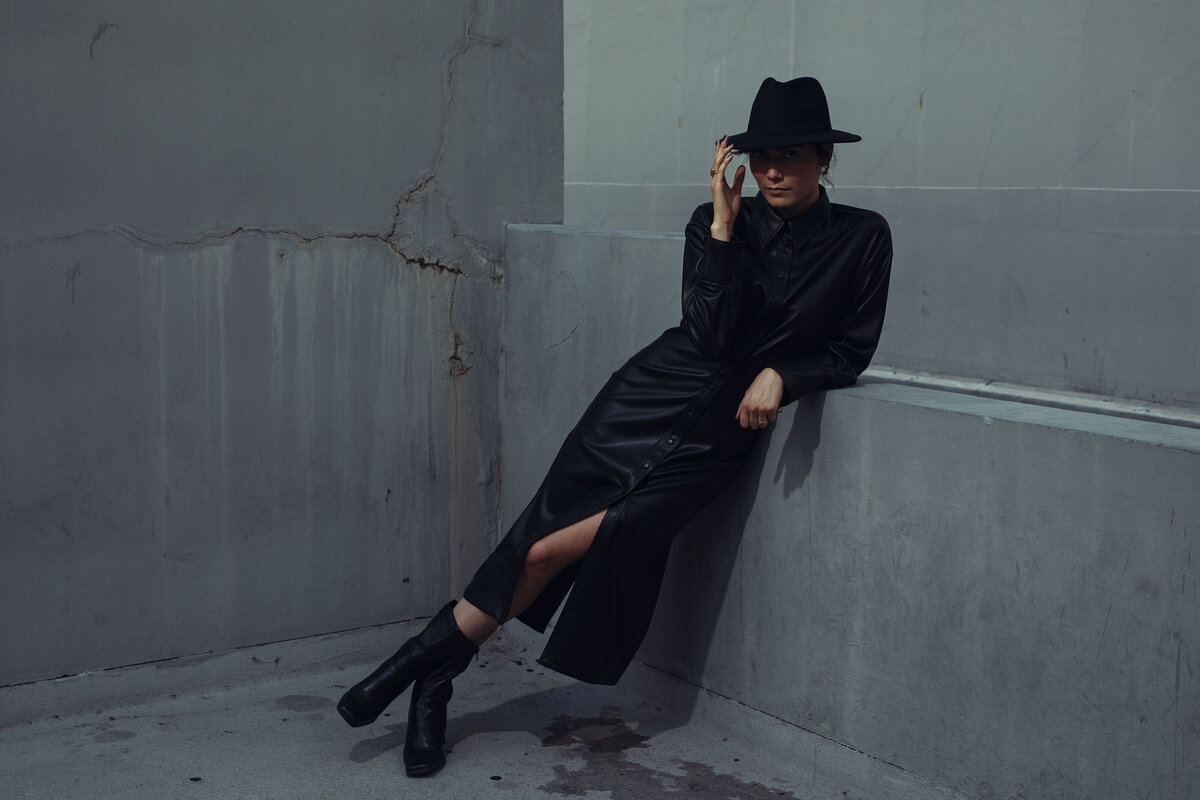 Portrait Photo Of Young Woman In Black Coat And Black Hat Los Angeles