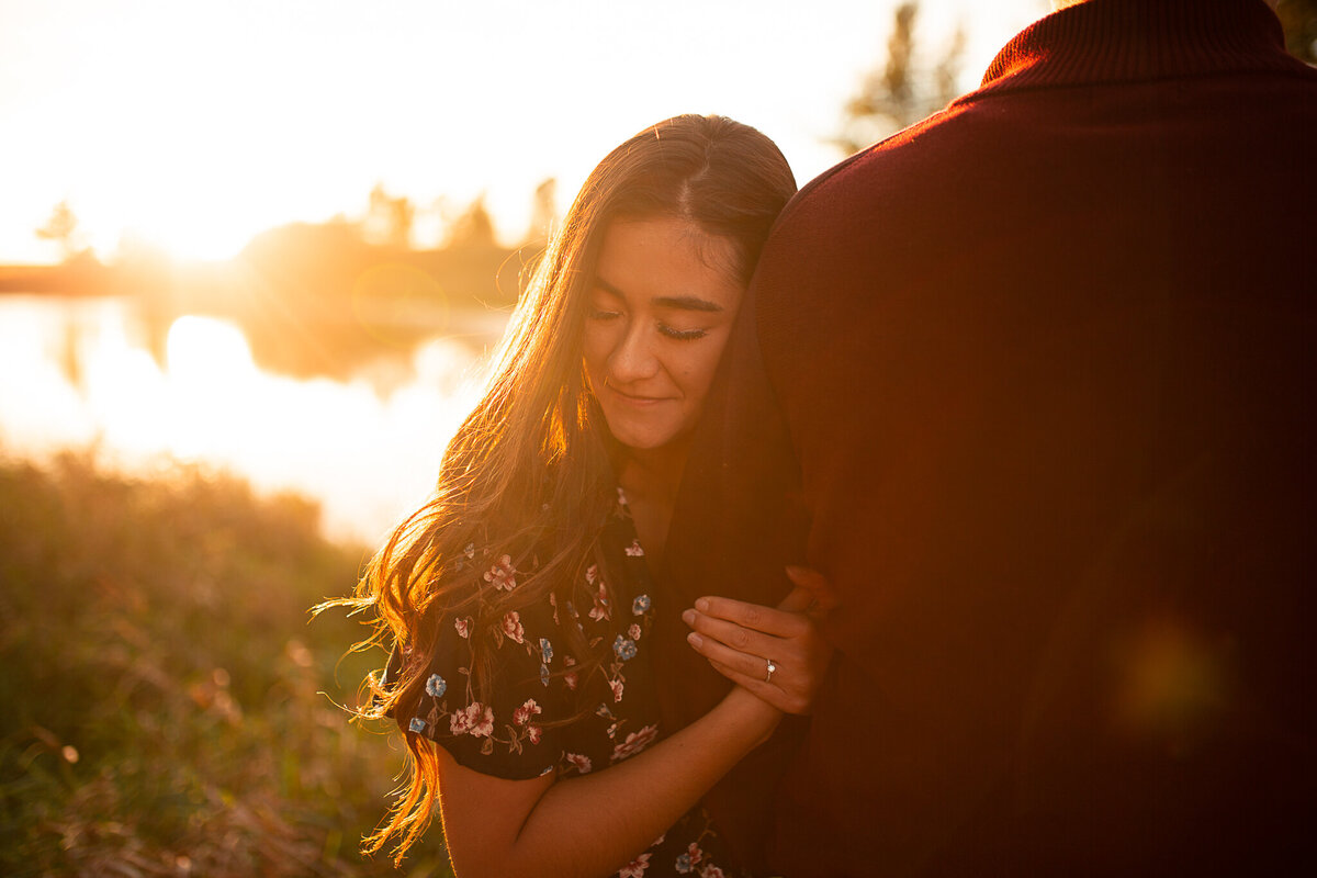 engagement-session-hugging-couple-sunset