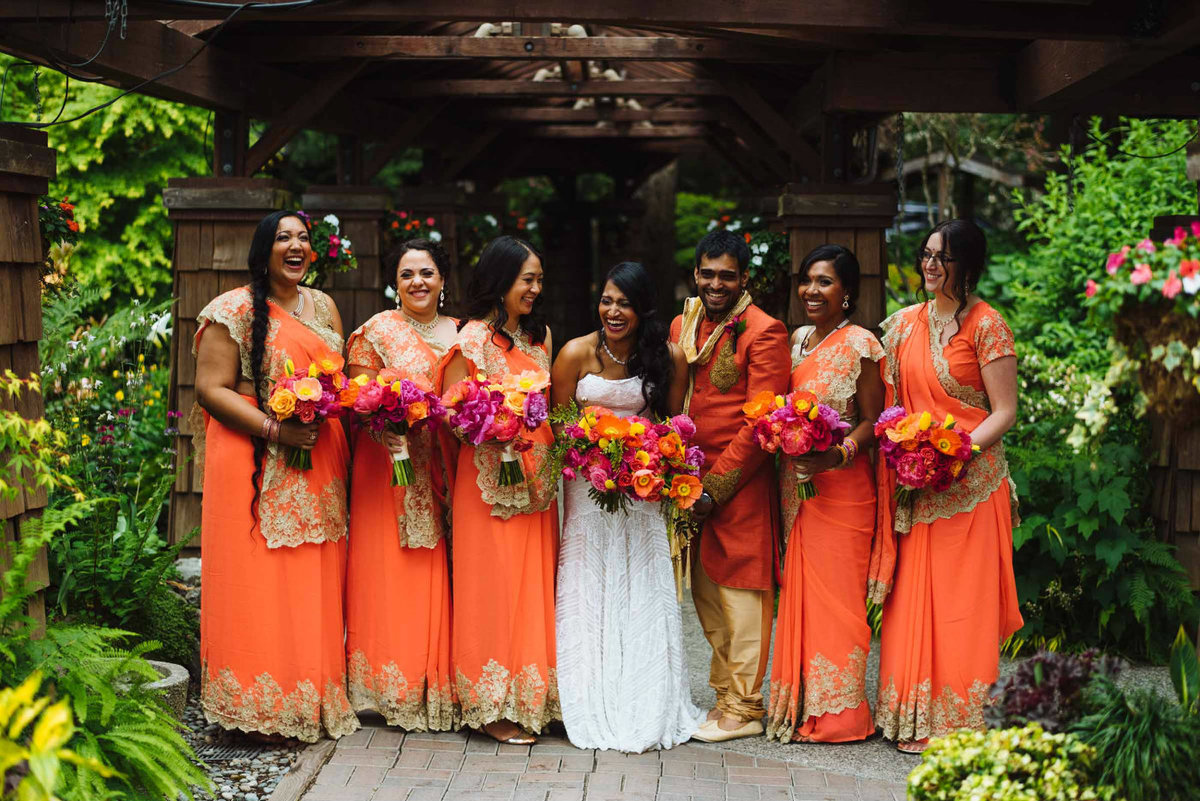 All the bridesmaids wore orange sari's for this indian springtime wedding.