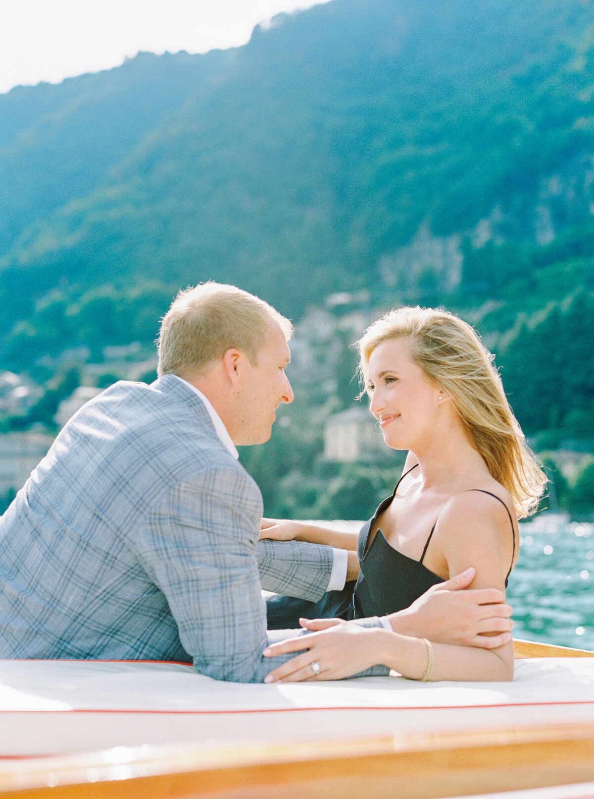 Film photograph engagement session on wooden boat on Lake Como Italy